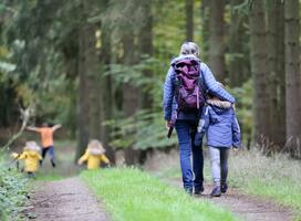 A woman and child walking through the woods | Chiropractic Ann Arbor