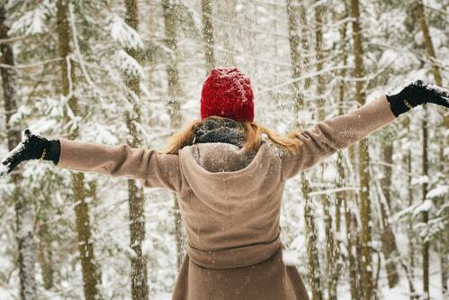 Woman enjoying the snow | Chiropractor Ann Arbor